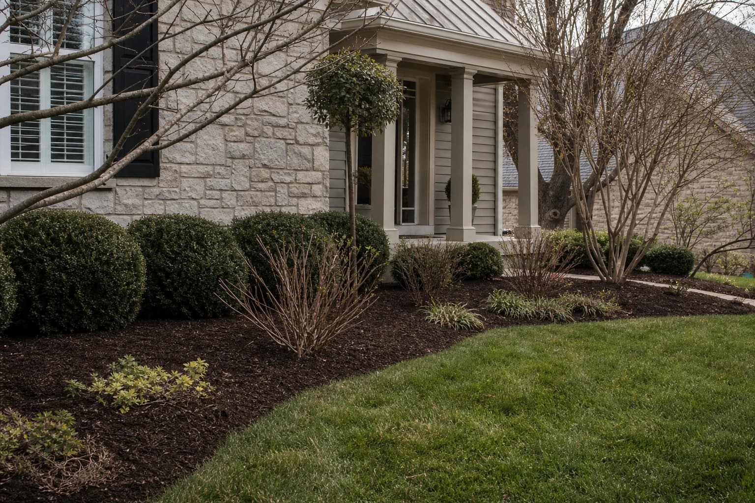 Cleaned and refreshed landscape beds at a Lexington property